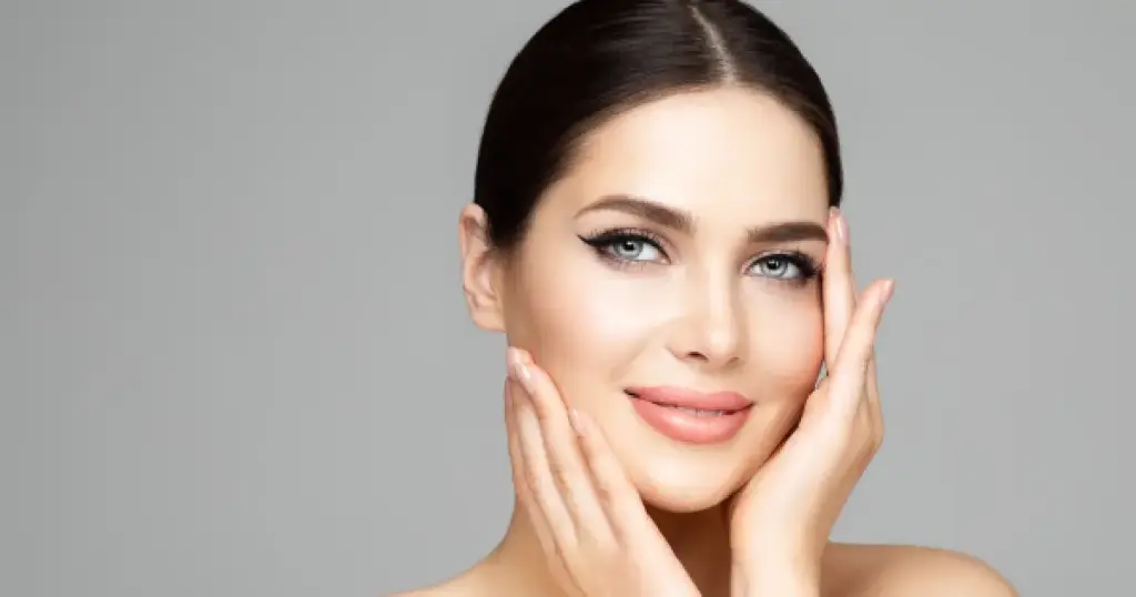 Smiling woman with clear, healthy skin, representing the results of Glo2Facial Treatment in Yukon OK